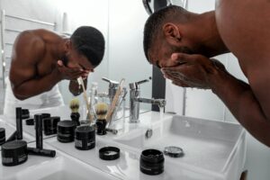 a man using skincare products- men 